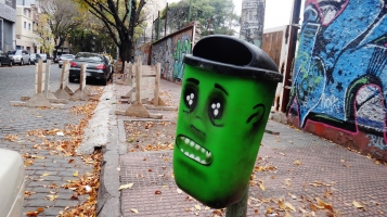 Buenos Aires green trash can graffiti